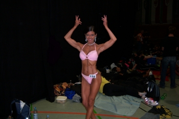 Tanja Baumann Posing - front view, hands raised above head