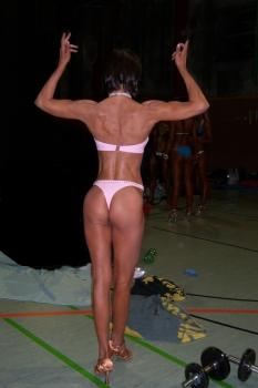 Tanja Baumann Posing - back view, hands raised above head