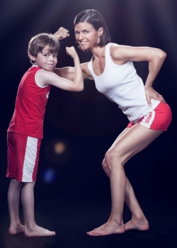 Tanja Baumann with her son Jason comparing their Bicep Muscles